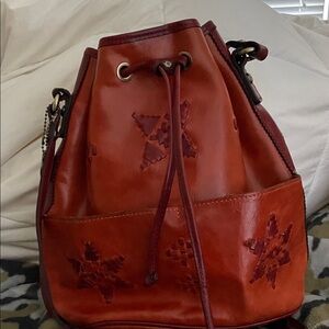 Patricia Nash Elegant Star-Embellished Leather Bucket Bag